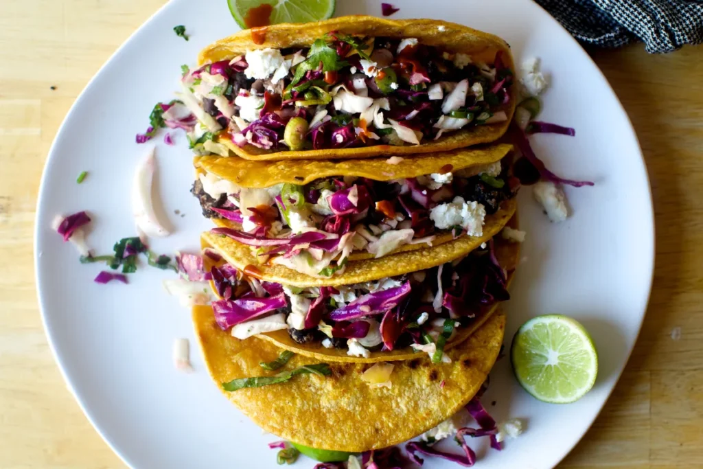 Crispy Cauliflower Black Bean Tostadas with Queso and Pickled Onion